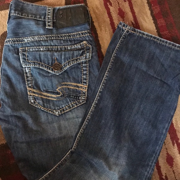 mens jeans with button back pockets